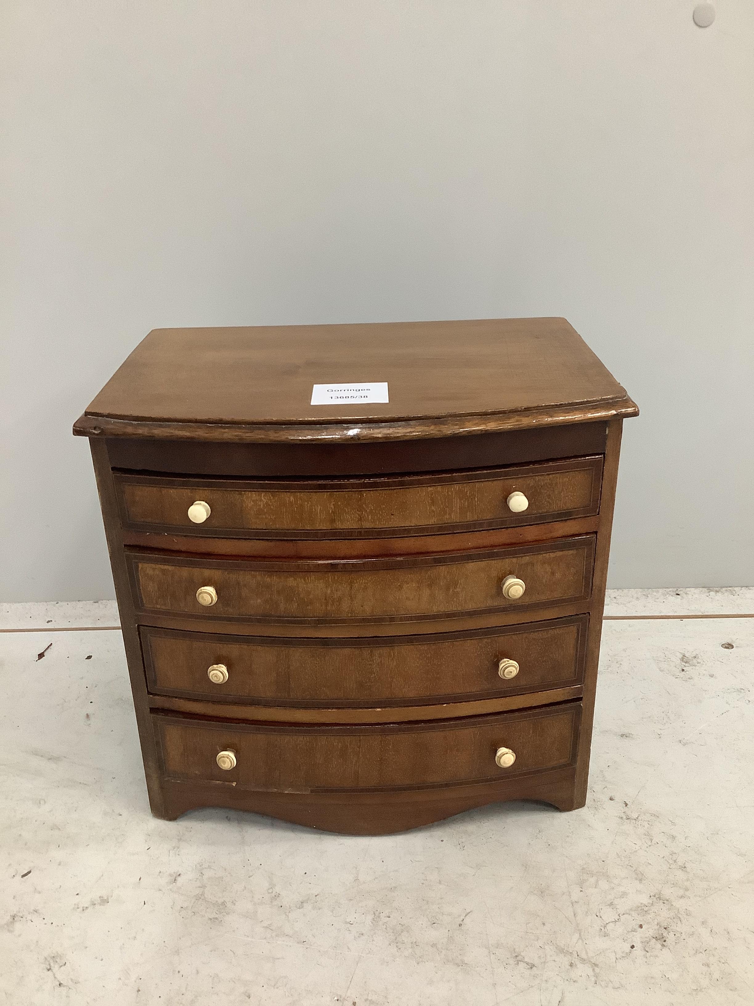 A 19th century miniature mahogany bowfront chest of four drawers, width 29cm, depth 20cm, height 28cm CITES Submission reference A647L6SD